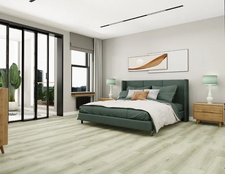 Bedroom with a deep green upholstered bed and light wood nightstands