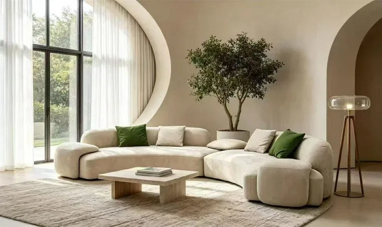 Living room with a beige modular sofa, a low coffee table and a potted tree