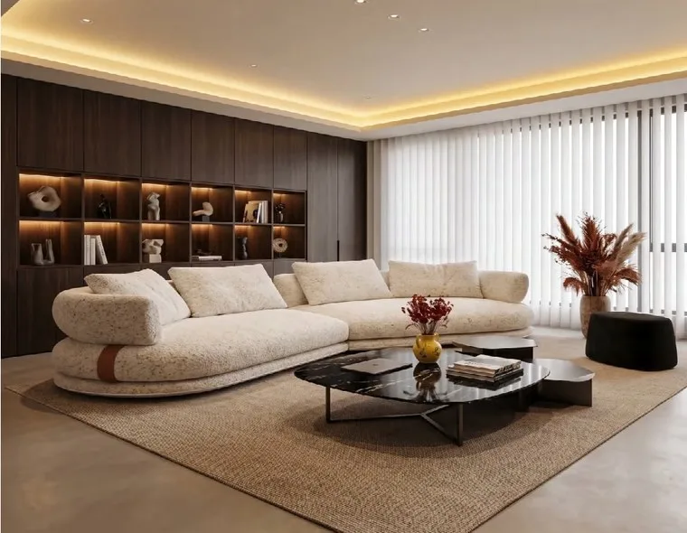 Living room with an off-white sectional sofa, a marble coffee table and a pampas vase