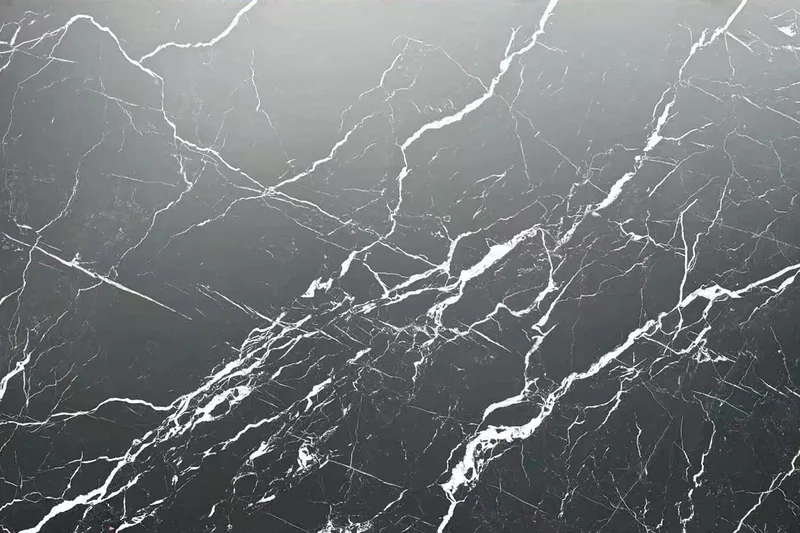 Black porcelain slab surface with bold white veining